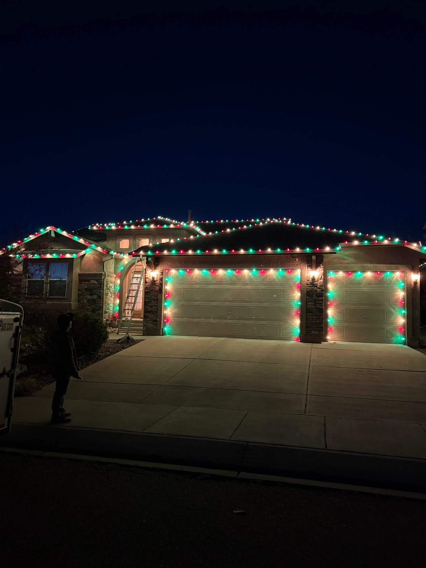 Red and green LED roofline with garage lighting — Front Range portfolio example