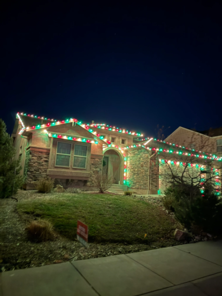 Multicolor LED lights on a two-story home — Front Range portfolio design idea for Northern Colorado